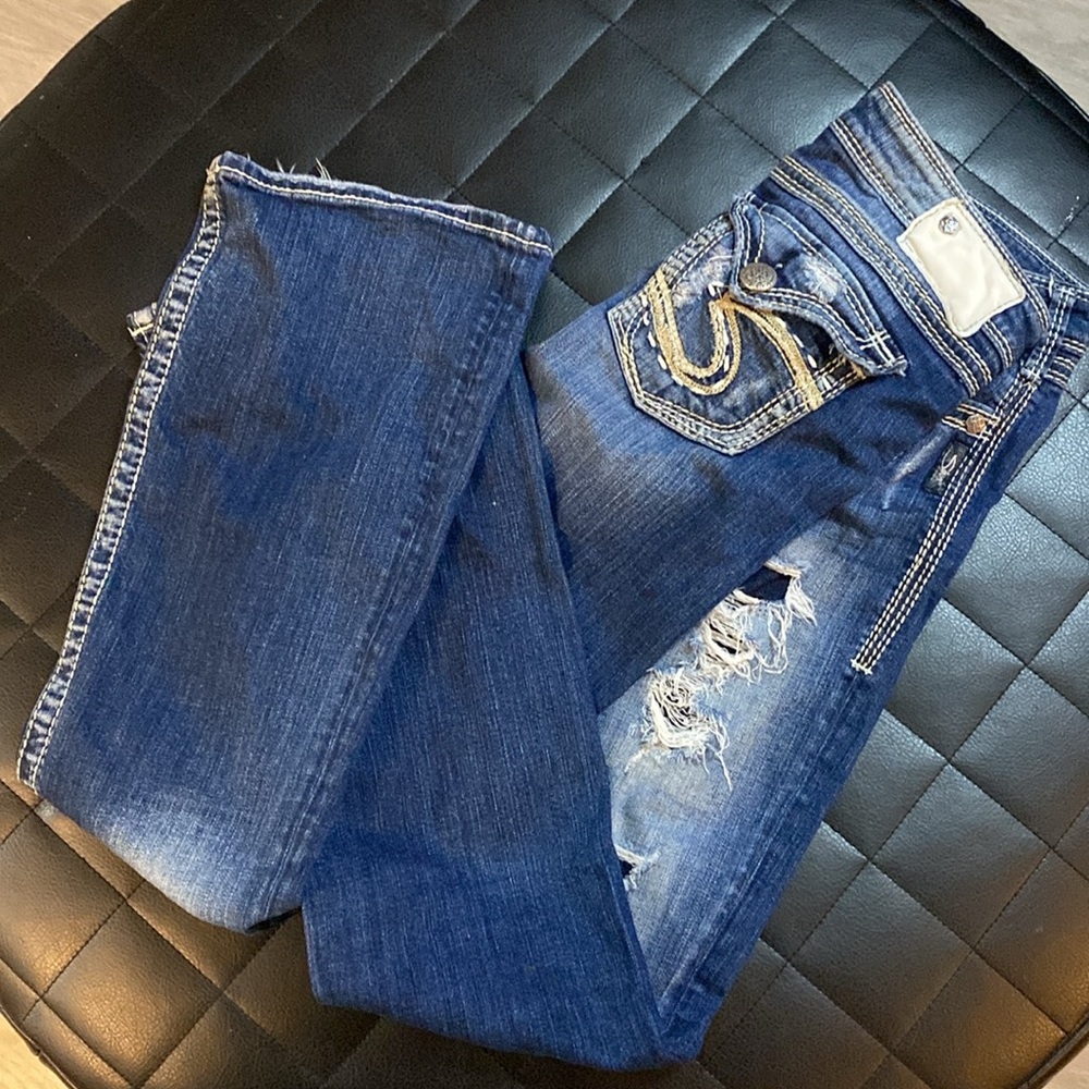 Distressed silver Jeans
